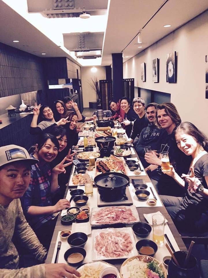 Tanya Hart enjoying a team dinner with Japanese and international friends in Niseko, Japan