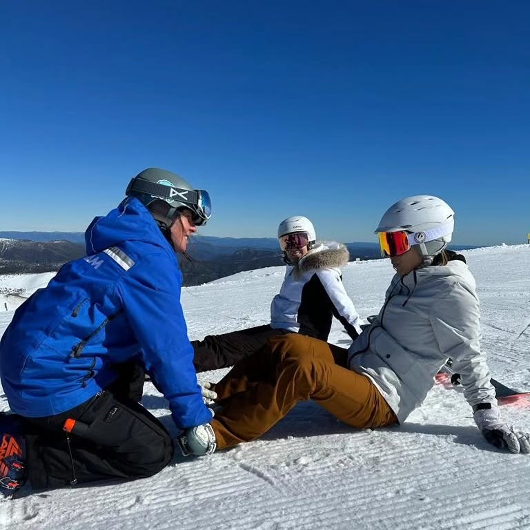Tanya Hart coaching women skiers during a ski clinic at Mount Hotham, Australia
