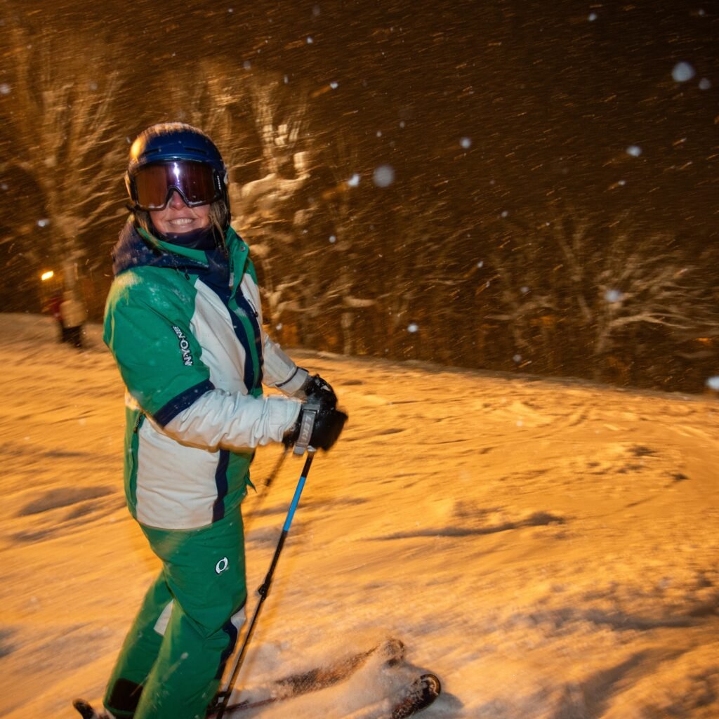 Night skiing in Niseko, Japan during fresh snowfall.