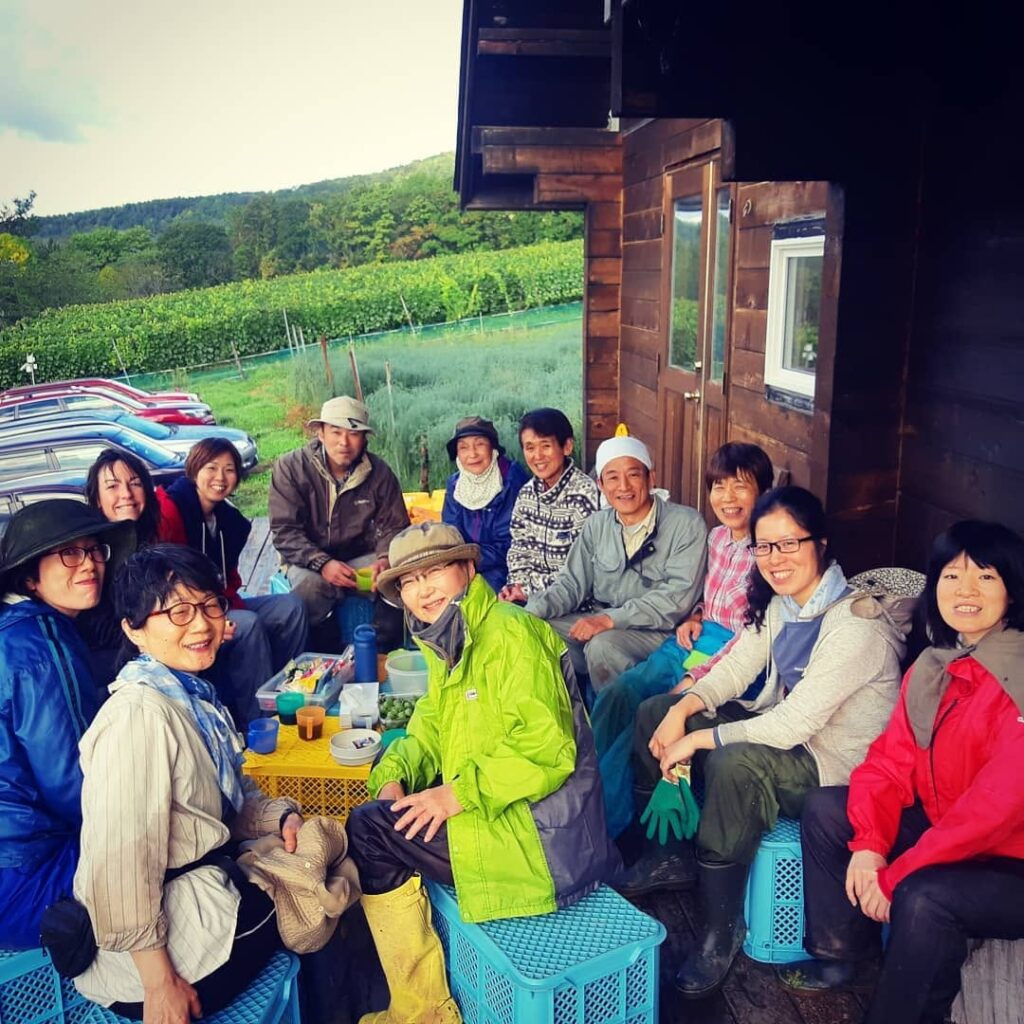 Tanya Hart helping with a harvest alongside local farmers in Hokkaido, Japan
